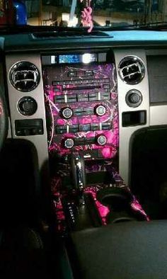 the interior of a car with pink flowers on it