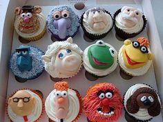 twelve cupcakes in the shape of sesame street characters