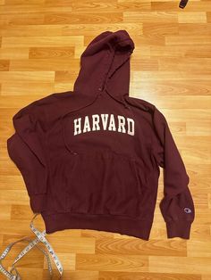 Harvard hoodie  - Rare  - 90's vintage  - Champion branded  - Champion sleeve logo embroidery  - Harvard spell out  - Embroidered logo  - Kangaroo pouch pocket   Size: Large  27" shoulder to waist  25" armpit to armpit  Good used condition  mild distressing on D in Harvard  No rips or holes  No stains Harvard Hoodie Aesthetic, Harvard Sweatshirt Aesthetic, Harvard Crewneck, Harvard Tshirt, Harvard Hoodie, My Chemical Romance Hoodie, Vintage Harvard Sweatshirt, Nascar Jacket, Cowichan Sweater