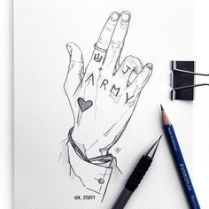 a drawing of a person's hand with the word love written on it and two pencils next to it