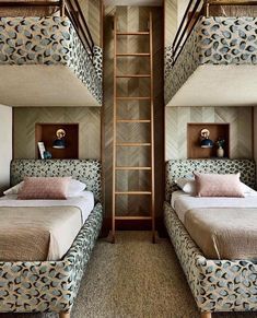 two beds in a room with bunk beds on each side and a ladder between them