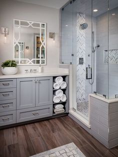 the bathroom is decorated in gray and white