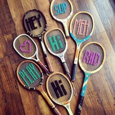 six tennis rackets with the words mr and mrs written on them, all in different colors