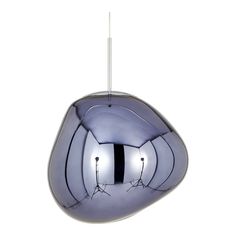 a silver object hanging from the ceiling with two lights on it's sides and one light at the end