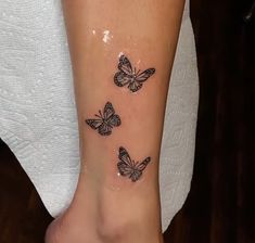 three butterflies on the ankle tattoo design for women and girls, one is black and white