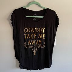 Nwt Project Karma Top. New With Tags! - Size: Medium - Gold Writing Says “Cowboy Take Me Away”. - 95% Rayon, 5% Spandex Measurements: Pit To Pit: 19.5”. Shoulder To Hem: 26.5”. Smoke Free Home. Offers Welcome! Note: All Measurements Are Taken While Garment Is Laying Flat. Measurements Are Approximate. Bin E Black Top For Spring Rodeo, Black Western Tops For Summer, Black Western Style Summer Tops, Black Western Style Tops For Summer, Trendy Black Tops For Rodeo, Black Western Top With Graphic Print, Welcome Note, Gold Writing, Cowboy