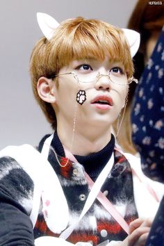 a young man with cat ears and piercings on his nose