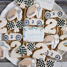 decorated cookies in the shape of numbers on a plate