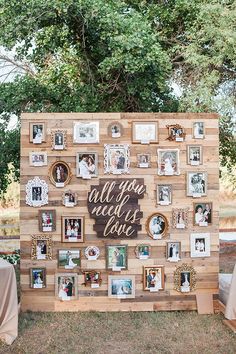 a wooden wall covered in pictures and framed photos