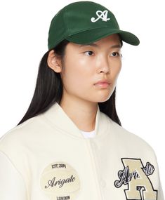 Cotton twill cap in off-white. · Curved brim · Logo embroidered at face · Embroidered eyelet vents at crown · Cinch fastening at back Supplier color: Ecru Spring Sports Baseball Cap With Curved Bill, Spring Casual Baseball Cap For Sports Events, Casual Baseball Cap For Spring Sports Events, Spring Baseball Cap For Sports Events With Curved Bill, Spring Sports Events Baseball Cap With Curved Bill, Spring Streetwear Baseball Cap With Curved Brim, College Baseball Cap With Embroidered Logo, Classic Spring Snapback Hat With Curved Brim, Classic Snapback Hat With Curved Brim For Spring