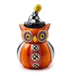 an orange owl figurine with a black and white checkered hat