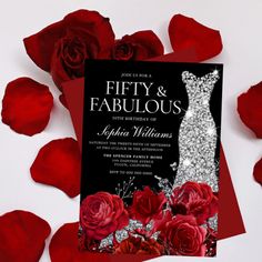 a black and white wedding card with red roses on the bottom is surrounded by silver sequins