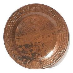 an antique copper plate on a white background