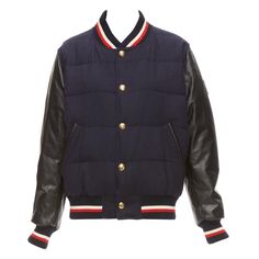 MONCLER GAMME BLEU navy wool leather sleeves goose down bomber jacket Sz2 M Reference: CNPG/A00071 Brand: Moncler Designer: Thom Browne Collection: Gamme Bleu Material: Wool, Leather Color: Black, Navy Pattern: Solid Closure: Snap Buttons Lining: Multicolour Fabric Extra Details: Styled with Thom Browne's signature preppy aesthetic, the Quilted Varsity Jacket epitomises the acclaimed designer‚Äôs approach to outerwear. Block colours fuse effortlessly in a classic varsity silhouette with supremel Mens Blue Jacket, Mens Padded Jacket, Blue Jacket Men, Moncler Women, Sheep Skin, Men's Jackets, Men's Outerwear, Preppy Aesthetic, Leather Sleeve