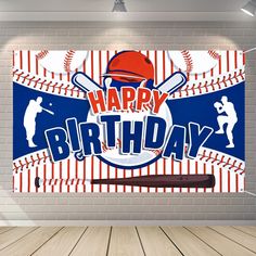 a happy birthday banner with baseballs, bats and ball on it in front of a brick wall