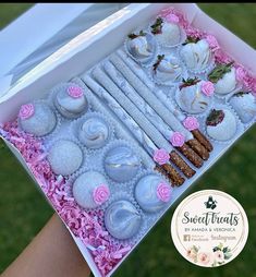 a box filled with lots of different types of pastries