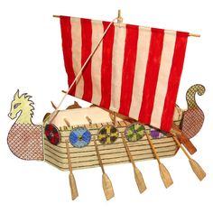 an image of a boat with paddles and a dragon