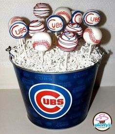 the chicago cubs cake pops are in a bucket