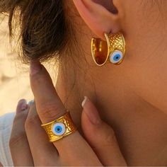 Boho Evil Eye Hoop Earrings In Gold Tone Hardware Stainless Steel 18k Gold Plated The Color Is More Like The First Picture New (Boutique Packaging) **Let Me Know If You Like To Bundle With Another Listing! **I Always Accept Reasonable Offers Cute Earrings Cute Jewelry Dainty Jewelry Summer Vacation Cute Outfits Trendy Jewelry Formal Jewelry Wedding Earrings Lovers Gift Holiday Gift Gift For Her Tags : Anthro Anthropologie Free People We The Free Zara Zara Jewelry Lili Pulitzer Kendra Scott 8 Oth Nazar Ring, Formal Jewelry, Evil Eye Design, Wedding Types, Devil Eye, Evil Eye Earrings, Eye Earrings, Eye Design, Stainless Steel Earrings