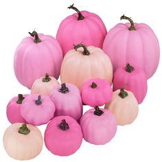 a group of pink and white pumpkins sitting next to each other