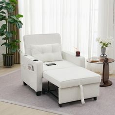 a white reclining chair and ottoman in a living room