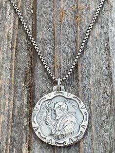 "This is a sterling silver antique replica of a rare St. Padre Pio medal from Italy. I am blessed to own this original and be able to share with you. The medal is available by itself (on a jump ring) or on a chain. The front of the medal has Padre Pio with his hand raised to show his stigmata (marks of the wounds of Christ). The obverse says \"Padre Pio pray for us\". A gorgeous piece that measures a bit over 3/4 inch diameter. For the chain option, this medal dangles on a 20 inch long, 1.5mm ox St Padre Pio, Cross Medal, Hand Raised, Our Lady Of Lourdes, I Am Blessed, Pray For Us, Sacred Heart, Jump Rings, Ox