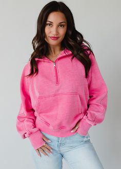 The sweatshirt you'll be living in all year long! Our new comfy bright pink hooded sweatshirt is there perfect option for casual wear.  Bright pink hooded sweatshirt Quarter zipper closure on the front Long sleeves with thumbholes Front kangaroo pocket Slightly cropped hemline Model is wearing a size small  Designed in the U.S.A. Produced in China.  60% Cotton / 40% Polyester Blouses Vintage, Flannel Sweatshirt, Colorful Sweatshirt, Cozy Fabric, Skirt Style, Top Graphic Tees, Quarter Zip Pullover, Pink Sweatshirt, Pink Hoodie