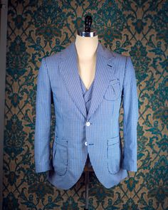 "ABOUT THIS STYLE: This style is inspired by the suits of the late 1920s and early 1930s. The sort of suit that you would throw on to go to the racetrack or a summer party. The jacket features a low lapel gorge, full lapels, and pleated patch pockets that are completely stitched by hand with handmade bartacks in the pocket corners. In our own era, this is the perfect suit for a summer wedding, whether you are the one getting married or are attending as a guest. THE MUSLIN FITTING PROCESS: The pr Pinstripe Suits With Welt Pockets And Lapel Collar, Spring Pinstripe Suits, Spring Vintage Tailored Suits, Spring Semi-formal Pinstripe Suits, Retro Fitted Suits For Spring, Retro Fitted Spring Suits, Spring Retro Fitted Suits, Vintage Semi-formal Spring Suits, Retro Notch Lapel Suits For Workwear