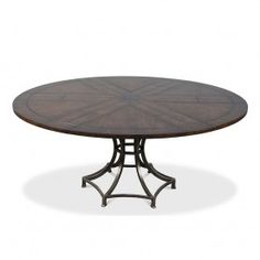 an oval dining table with metal legs and a wooden top, on a white background