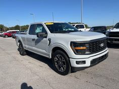 a white truck parked in a parking lot