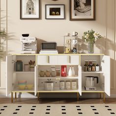 a white cabinet with shelves and pictures on the wall