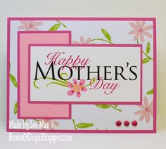 a mother's day card with pink flowers and green leaves on the bottom corner