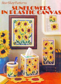 the cover of sunflowers in plastic canvass is shown next to two mugs and