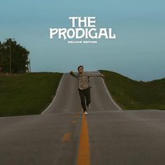 the prodigal movie poster with a man running down the middle of an empty road