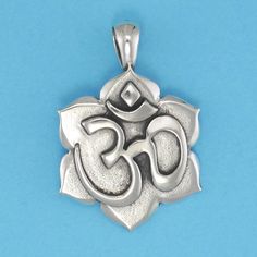 DESCRIPTION OM is the sacred sound of the universe. Chanting the OM during meditation positively impacts the mind and body. This elegant pendant will remind of that powerful feeling. Original design by Pat Frey 1 5/16 inch length. Type: Three Dimensional. Item Number: 1324 Spiritual Oxidized Flower Pendant Jewelry, Oxidized Pendant For Meditation, Oxidized Finish Pendant For Meditation, Spiritual Oxidized Finish Jewelry For Meditation, Symbolic Oxidized Finish Necklace For Meditation, Spiritual Jewelry With Large Pendant, Spiritual Necklaces With Oxidized Finish For Meditation, Symbolic Round Pendant Jewelry For Meditation, Spiritual Large Pendant Jewelry For Meditation