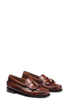 A kiltie vamp and swingy tassels add eye-catching detail to this moc toe-loafer that'll elevate your work or weekend ensembles. Leather upper, lining and sole Imported Classic Brown Oxfords With Tassels, Classic Brown Tassel Loafers With Stitched Sole, Classic Plain Toe Tassel Loafers For Fall, Classic Tassel Loafers With Brogue Detailing For Fall, Classic Brown Tassel Loafers For Fall, Brown Classic Tassel Loafers For Fall, Goodyear Welted Slip-on Leather Tassel Loafers, Semi-formal Moc Toe Tassel Loafers With Leather Sole, Brown Slip-on Tassel Loafers With Leather Lining