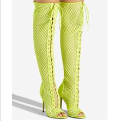 Details A Sexy Over-The-Knee Mesh Boot Featuring A Stiletto Heel, Adjustable Laces, And Back Zipper Closure. Material: Textile/Faux-Suede Calf Circumference: Reg: 16.5"; Wide Calf: 17.5" Color: Neon Yellow Outside Heel Height: 4" Closure: Adjustable Laces Shaft Height: 22" Knee-high Boots For Club In Spring, Trendy Summer Club Boots, Trendy Summer Party Boots, Thigh High Heels For Club, Summer Party Open Toe Boots, Fitted Thigh High Club Heels, Fitted Open Toe Boots For Club, Spring Club Knee-high Heels, Spring Knee-high Boots For Club