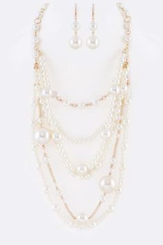 Mix Pearl Statement Layer Necklace Set Experience the elegance of layered pearls with this statement necklace set. This set includes multiple strands of pearls, creating a luxurious and classic look that will elevate any outfit. Made with high-quality materials, this necklace set is built to last and perfect for special occasions or adding a touch of sophistication to your everyday style.Necklace 1- 19" + ExtensionNecklace 2- 26"Earrings - 2.25" DropLead & Nickel Compliant Formal Multi-strand Pearl Necklace, Elegant Multi-strand Pearl Layered Necklace, Pearl White Multi-strand Pearl Necklace, White Elegant Multi-strand Layered Necklace, Elegant White Multi-strand Layered Necklace, Elegant White Pearl Layered Necklace, Elegant Multi-strand Pearl Necklace, Multi-strand Pearl Drop Necklaces For Party, Multi-strand Pearl Chain Jewelry