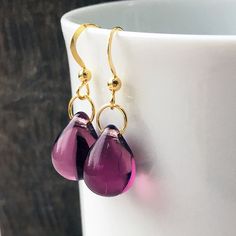 A lovely shade of plum, burgundy wine colour is shown in these elegant vermeil dangly glass teardrop earrings. The vermeil wires have with small clear stoppers.  Vermeil is 18k gold layered over sterling silver. The light shines through the glossy glass bead and gives these drops a gorgeous internal glow.   The tear drop is a shape which is sure to delight when gift giving. These come in sterling too - https://etsy.me/3wMlczK See these in other colours - https://etsy.me/3Dylcpd -  Overall earrin Purple Teardrop Pearl Drop Earrings, Purple Teardrop Pearl Drop Jewelry, Purple Dangle Teardrop Earrings Gift, Burgundy Teardrop Jewelry For Gifts, Elegant Briolette Teardrop Earrings Gift, Hypoallergenic Purple Dangle Teardrop Earrings, Elegant Handmade Teardrop Pendant Drop, Elegant Handmade Drop Earrings As Gift, Elegant Handmade Drop Gift