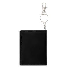 Patent leather bi-fold wallet. Printed artwork. Chain with toggle hook. Interior pockets & cardholders. Magnetic snap closure.