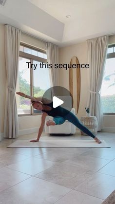 a woman is doing yoga on a mat in front of a window with the words try this sequence