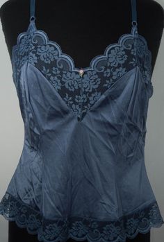 Here's a sweet and lovely vintage camisole and matching half slip you'll adore. This 1970's cami and slip set has an original made in U.S.A. JCPenney "Fantasia" line label. You'll love feeling groovy in this bohemian style, hourglass, romantic lingerie slip outfit and you'll love wearing it with your other period collectibles. This figure-flattering smoky blue colored, lace trimmed tank camisole top and skirt slip are in excellent condition with more minor signs of wear/use. The label says this Lingerie Top Outfit, Slip Outfit, 70s Lingerie, Vintage Camisole, Feeling Groovy, Smoky Blue, Vintage Slip, Lingerie Top, Vintage Slips