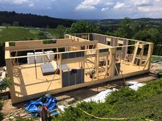 a house being built in the middle of a field