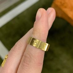 Like a band unearthed from centuries past, the faceted Ode Ring is fully customizable with hand-engraved lettering. Prounis jewels are made with a custom shade of the ancient 22-karat alloy. Each piece begins with a soft matte finish, and over time the wearer�s skin will polish the metal, creating a lustrous velvety shine. Gold Brass Engraved Ring For Promise, Symbolic Hand Forged Signet Ring As Gift, Yellow Gold Brass Engraved Ring For Promise, Symbolic Yellow Gold Engraved Brass Ring, Adjustable Gold Engraved Signet Ring, Gold Jewelry With Initials For Promise, Symbolic Hand Forged Engraved Ring As Gift, Symbolic Hand-forged Engraved Ring As A Gift, Gold Promise Jewelry With Initials