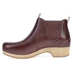 The Becka is a low bootie that combines chic simplicity with the heritage of Dansko. Pull tabs and double gore provide easy entry to a boot we made with our patented stapled construction and a midsole modeled after our iconic rocker bottom for a high energy option that will keep you moving forward through any autumn occasion. Teacher Shoes, Mary Jane Clogs, Clog Boots, High Energy, Sneaker Heels, Shoe Care, Leather Cover, Moving Forward, Sock Shoes