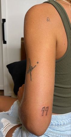 a woman with a small tattoo on her arm