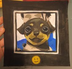 a painting of a dog in a frame with a smiley face