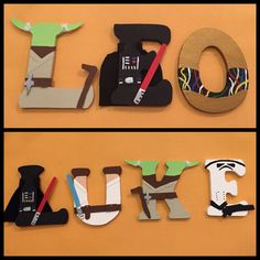 the word love spelled out in cutout letters with star wars characters on them, including darth vader and yoda