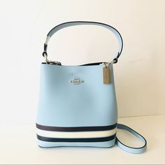 Nwt Coach Small Town Bucket Bag And In Colorblock With Stripe In Black And White Over Blue Pebbled Leather With Silver Hardware. This Convertible Bag Can Be Held In Hand Or Worn As A Shoulder Bag Or Crossbody Bag. Perfect As A Gift Or Daily Use. Color: Sv/Waterfall Midnight Multi Pocketbook Details: Polished Pebble Leather Center Zip Compartment Snap Closure Handle With 6 3/4" Drop Detachable Strap With 22" Drop For Shoulder Or Crossbody Wear 8 1/2" (L) X 8 3/4" (H) X 4" (W) Style No. C4080 Purse Boutique, Uniqlo Bags, Vintage Chanel Handbags, Sequin Bag, Carryall Tote, Glam Bag, Polished Pebble, Vintage Leather Bag, Blue Purse