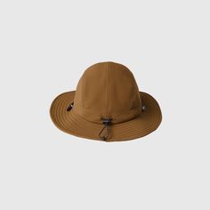 Official FIGS® Scrubs. Get Free Shipping On Orders $50+! | FIGS Earth Utility Adventure Cap Khaki Hats For Outdoor Fall Use, Khaki Outdoor Hat For Fall, Brown Bucket Hat For Outdoor, Brown Outdoor Bucket Hat, Fall Outdoor Khaki Hat, Casual Bucket Hat For Fall Outdoor Activities, Casual Outdoor Bucket Hat For Fall, Casual Fall Bucket Hat For Outdoor, Casual Fall Outdoor Bucket Hat